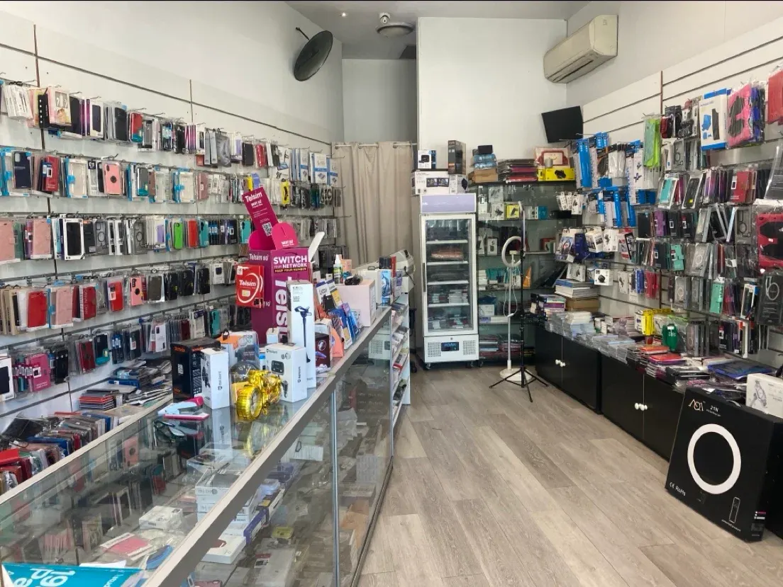 Inside YR MART: walls of phone cases and the repair counter